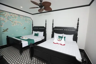 Habitación King con dos camas King — Phú Gia 228 Lê Văn Lương